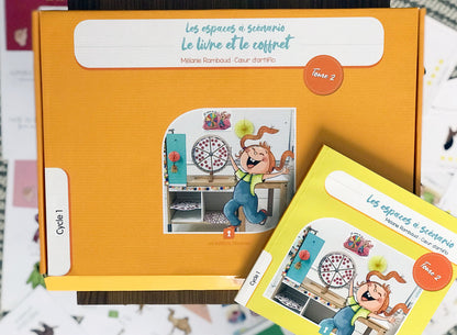 Photo du coffret orange et du livre Les espaces à scénario, tome 2